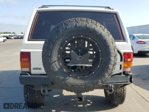 1996 Jeep Cherokee SE z VIN 1J4FJ28S7TL270218, wystawiony jako Copart lot #55302885 z przebiegiem 239 209 mil mil oraz Szkoda całkowita • Salvage title. Historia ofert i sprzedaży dostępna na DreamBid. Obrazek 6.
