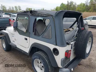 1998 Jeep Wrangler Sport with VIN 1J4FY19S0WP779147, listed as a IAAI auction lot 42045723 with 205,822 mi miles. Bid and sale history available at carsss.com. Image 16.