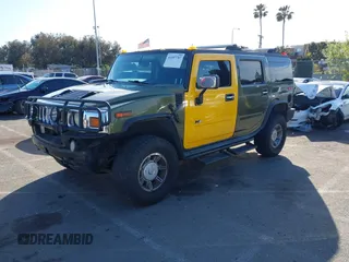 2003 Hummer H2 z VIN 5GRGN23UX3H124727, wystawiony jako IAAI lot #41697787 z przebiegiem 241 554 mil mil oraz . Historia ofert i sprzedaży dostępna na DreamBid. Obrazek 2.