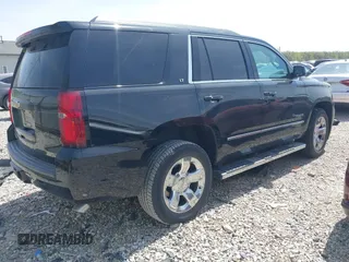 2018 Chevrolet Tahoe LT with VIN 1GNSKBKC7JR245565, listed as a IAAI auction lot 42097400 with 123,709 mi miles and . Bid and sale history available at DreamBid. Image 4.