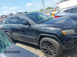 2014 Jeep Grand Cherokee Limited with VIN 1C4RJFBG3EC545861, listed as a IAAI auction lot 42216743 with 160,000 mi miles and . Bid and sale history available at DreamBid. Image 13.