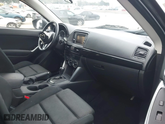 2014 Mazda CX-5 Touring z VIN JM3KE2CY3E0355332, wystawiony jako IAAI lot #42096306 z przebiegiem 108 198 mil mil oraz . Historia ofert i sprzedaży dostępna na DreamBid. Obrazek 5.