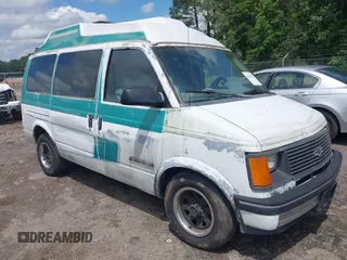 1991 Chevrolet Astro Cargo z VIN 1GBDM19Z7MB202913, wystawiony jako IAAI lot #42363530 z przebiegiem 191 695 mil mil oraz . Historia ofert i sprzedaży dostępna na DreamBid. Obrazek 1.