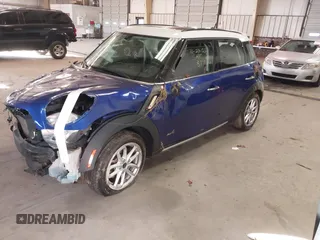 2015 MINI Countryman S z VIN WMWZC5C58FWP45505, wystawiony jako IAAI lot #41012241 z przebiegiem 108 986 mil mil oraz . Historia ofert i sprzedaży dostępna na DreamBid. Obrazek 2.