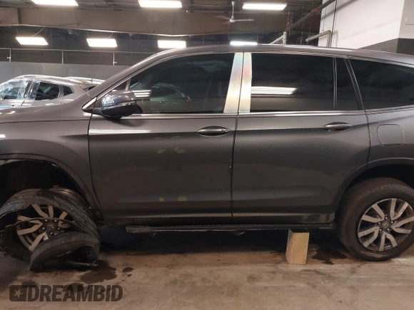 2022 Honda Pilot EX-L with VIN 5FNYF6H59NB000754, listed as a IAAI auction lot 42090576 with 32,813 mi miles and . Bid and sale history available at DreamBid. Image 14.