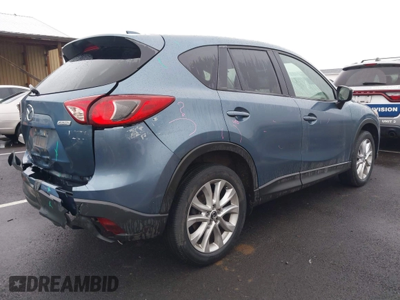 2015 Mazda CX-5 Grand Touring with VIN JM3KE4DY0F0493969, listed as a IAAI auction lot 41581885 with 71,014 mi miles. Bid and sale history available at carsss.com. Image 4.