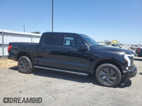 2023 Ford F-150 Lightning Pro with VIN 1FTVW1EV1PWG17333, listed as a Copart auction lot 57904025 with 21,173 mi miles and Salvage title. Bid and sale history available at DreamBid. Image 4.