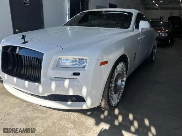 2015 Rolls-Royce Wraith with VIN SCA665C52FUX85482, listed as a Copart auction lot 77887554 with 99,781 mi miles and Salvage Title. Bid and sale history available at carsss.com. Image 2.