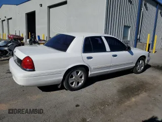 2011 Ford Crown Victoria LX z VIN 2FABP7EV1BX147343, wystawiony jako Copart lot #84844144 z przebiegiem 139 638 mil mil oraz Czysty tytuł • Clean title. Historia ofert i sprzedaży dostępna na DreamBid. Obrazek 3.