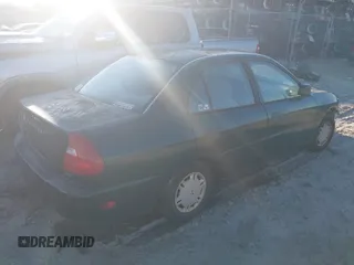1999 Mitsubishi Mirage DE z VIN JA3AY26A0XU017889, wystawiony jako IAAI lot #40457172 z przebiegiem Nie podano mil oraz . Historia ofert i sprzedaży dostępna na DreamBid. Obrazek 4.