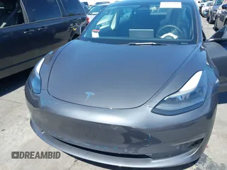 2022 Tesla Model 3 with VIN 5YJ3E1EA0NF344782, listed as a IAAI auction lot 41803469 with 16,973 mi miles and . Bid and sale history available at DreamBid. Image 10.