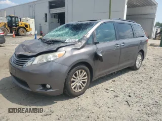 2015 Toyota Sienna XLE with VIN 5TDYK3DC6FS576670, listed as a Copart auction lot 62612345 with 106,475 mi miles and Salvage title. Bid and sale history available at DreamBid. Image 1.