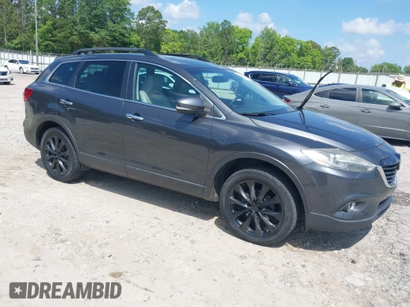 2014 Mazda CX-9 Grand Touring with VIN JM3TB2DA4E0436340, listed as a IAAI auction lot 42442249 with 102,856 mi miles and . Bid and sale history available at DreamBid. Image 1.