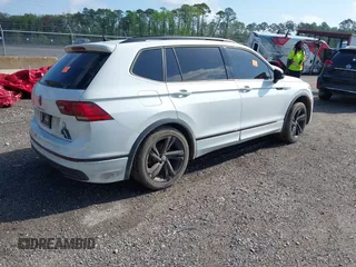 2023 Volkswagen Tiguan SE R-Line Black with VIN 3VVCB7AX9PM042025, listed as a IAAI auction lot 41913943 with 114,097 mi miles and . Bid and sale history available at DreamBid. Image 4.
