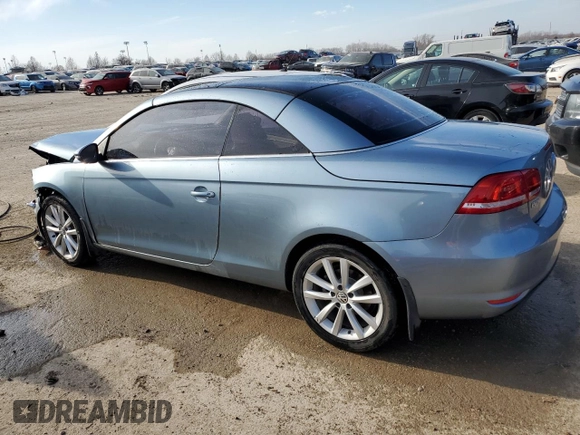2015 Volkswagen Eos Komfort with VIN WVWBW8AH2FV000829, listed as a Copart auction lot 43082344 with 68,099 mi miles and Salvage Title. Bid and sale history available at DreamBid. Image 2.