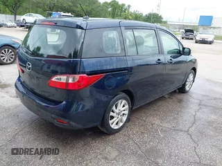 2014 Mazda 5 Sport with VIN JM1CW2BL6E0169672, listed as a IAAI auction lot 42422459 with 212,179 mi miles and . Bid and sale history available at DreamBid. Image 4.