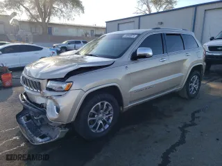 2014 Jeep Grand Cherokee Overland with VIN 1C4RJFCM2EC556953, listed as a Copart auction lot 73046974 with 106,889 mi miles and Salvage Title. Bid and sale history available at carsss.com. Image 1.