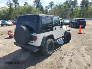 2003 Jeep Wrangler Rubicon z VIN 1J4FA69S73P333199, wystawiony jako Copart lot #50602615 z przebiegiem 133 254 mil mil oraz Szkoda całkowita • Salvage title. Historia ofert i sprzedaży dostępna na DreamBid. Obrazek 3.