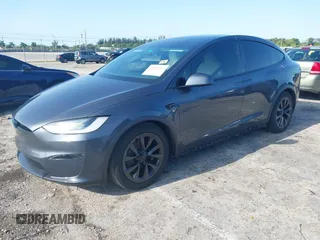 2022 Tesla Model X with VIN 7SAXCDE54NF342256, listed as a IAAI auction lot 41991212 with 28,740 mi miles and . Bid and sale history available at DreamBid. Image 17.