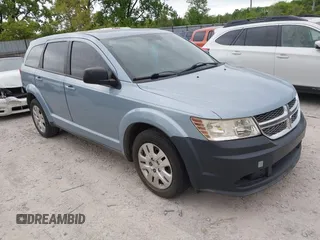 2013 Dodge Journey American Value z VIN 3C4PDCAB0DT578905, wystawiony jako IAAI lot #42256264 z przebiegiem 132 582 mil mil oraz . Historia ofert i sprzedaży dostępna na DreamBid. Obrazek 1.