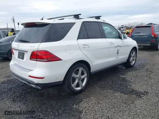 2017 Mercedes-Benz GLE with VIN 4JGDA5HB4HA964720, listed as a IAAI auction lot 41588045 with 66,549 mi miles. Bid and sale history available at carsss.com. Image 4.