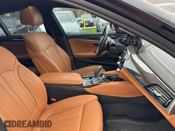 2018 BMW 5 Series M550i xDrive with VIN WBAJB9C57JB035521, listed as a Copart auction lot 54177125 with 63,924 mi miles and Clean Title. Bid and sale history available at carsss.com. Image 5.