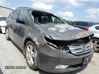 2011 Honda Odyssey Touring with VIN 5FNRL5H91BB045838, listed as a Copart auction lot 59612315 with Not provided miles and Salvage title. Bid and sale history available at DreamBid. Image 4.