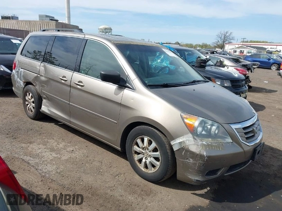 2010 Honda Odyssey EX-L with VIN 5FNRL3H68AB055744, listed as a IAAI auction lot 42107273 with 193,289 mi miles. Bid and sale history available at carsss.com. Image 1.