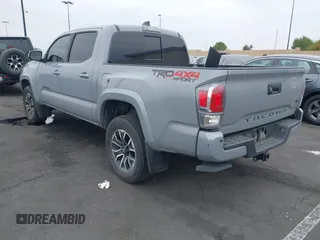 2021 Toyota Tacoma SR with VIN 3TMCZ5AN2MM405869, listed as a IAAI auction lot 42094533 with 78,449 mi miles and . Bid and sale history available at DreamBid. Image 3.