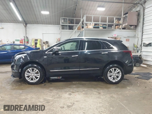 2022 Cadillac XT5 FWD Luxury with VIN 1GYKNAR47NZ100356, listed as a IAAI auction lot 42393314 with 91,492 mi miles and . Bid and sale history available at DreamBid. Image 14.