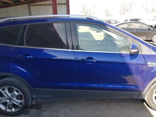 2016 Ford Escape Titanium with VIN 1FMCU9JXXGUB58961, listed as a IAAI auction lot 41772977 with 122,665 mi miles. Bid and sale history available at carsss.com. Image 13.