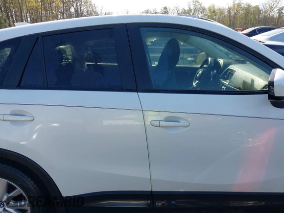 2014 Mazda CX-5 Touring with VIN JM3KE2CY5E0329783, listed as a IAAI auction lot 42017473 with 121,175 mi miles. Bid and sale history available at carsss.com. Image 13.