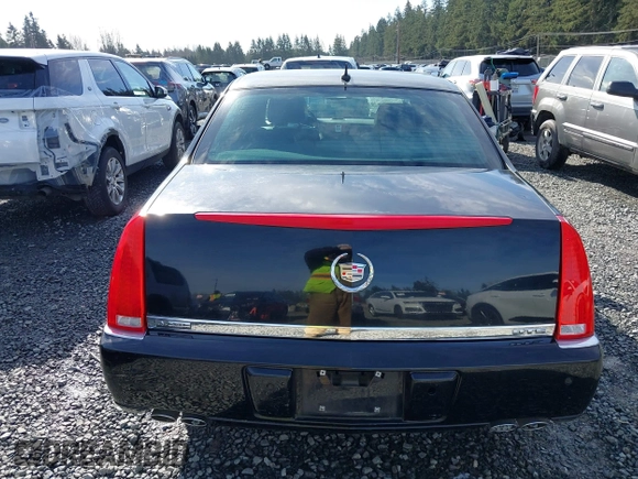 2006 Cadillac DTS 1SC z VIN 1G6KD57YX6U100634, wystawiony jako IAAI lot #41671007 z przebiegiem Nie podano mil oraz . Historia ofert i sprzedaży dostępna na DreamBid. Obrazek 16.