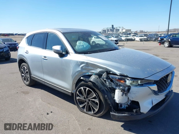2023 Mazda CX-5 2.5 S Premium Package with VIN JM3KFBDM9P0173453, listed as a IAAI auction lot 41807979 with 34,156 mi miles. Bid and sale history available at carsss.com. Image 1.