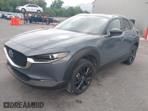 2022 Mazda CX-30 S Carbon Edition with VIN 3MVDMBCL6NM431985, listed as a IAAI auction lot 42610558 with Not provided miles and . Bid and sale history available at DreamBid. Image 2.