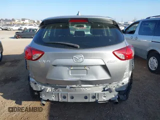 2014 Mazda CX-5 Sport with VIN JM3KE2BE9E0330345, listed as a IAAI auction lot 41377335 with 103,340 mi miles and . Bid and sale history available at carsss.com. Image 16.