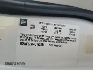 2004 Cadillac DeVille DTS z VIN 1G6KF57944U122824, wystawiony jako Copart lot #86147994 z przebiegiem 118 156 mil mil oraz Szkody całkowita. Historia ofert i sprzedaży dostępna na DreamBid. Obrazek 12.