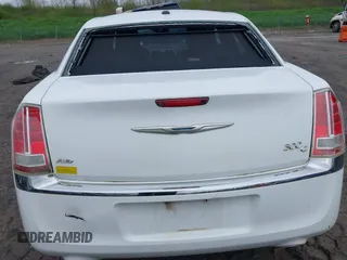 2014 Chrysler 300 C with VIN 2C3CCAKG5EH200996, listed as a IAAI auction lot 42201747 with 156,121 mi miles and . Bid and sale history available at carsss.com. Image 6.