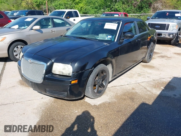 2005 Chrysler 300 with VIN 2C3JA43R65H668010, listed as a IAAI auction lot 41976405 with 216,099 mi miles. Bid and sale history available at carsss.com. Image 2.