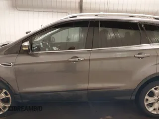 2014 Ford Escape Titanium with VIN 1FMCU9JX9EUA56421, listed as a IAAI auction lot 41392372 with 117,234 mi miles. Bid and sale history available at carsss.com. Image 15.