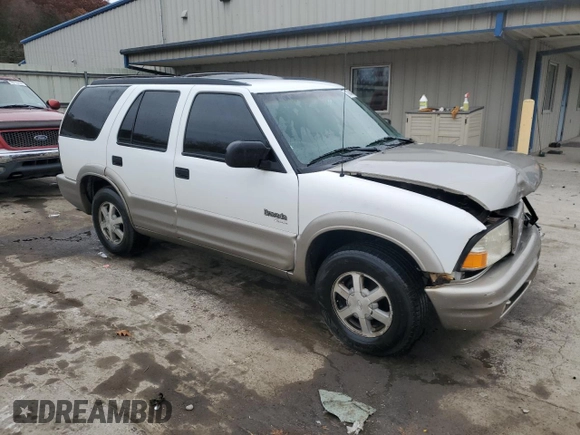 1999 Oldsmobile Bravada z VIN 1GHDT13W6X2718787, wystawiony jako Copart lot #78848404 z przebiegiem 229 665 mil mil oraz Szkody całkowita. Historia ofert i sprzedaży dostępna na DreamBid. Obrazek 4.