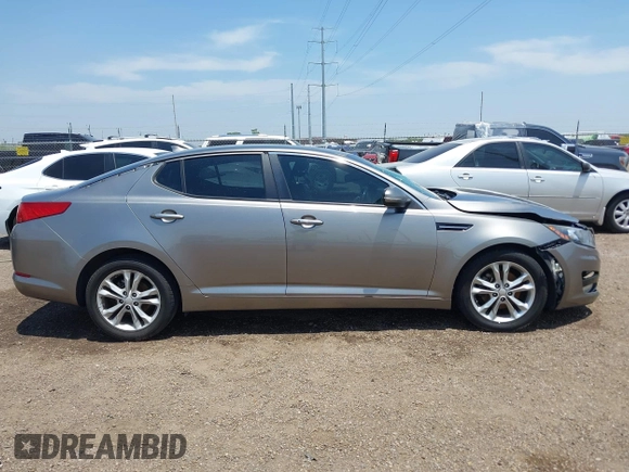 2013 Kia Optima EX z VIN 5XXGN4A7XDG258162, wystawiony jako IAAI lot #42228606 z przebiegiem 129 296 mil mil oraz . Historia ofert i sprzedaży dostępna na DreamBid. Obrazek 13.
