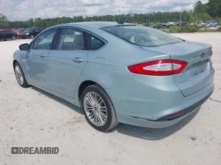 2013 Ford Fusion SE Hybrid z VIN 3FA6P0LU8DR265460, wystawiony jako IAAI lot #42720385 z przebiegiem 146 179 mil mil oraz . Historia ofert i sprzedaży dostępna na DreamBid. Obrazek 3.