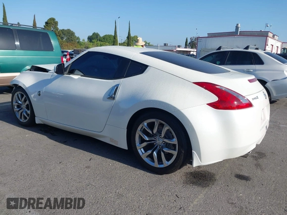 2014 Nissan 370Z Touring with VIN JN1AZ4EH7EM635655, listed as a IAAI auction lot 42217280 with 150,200 mi miles and . Bid and sale history available at DreamBid. Image 3.