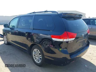 2014 Toyota Sienna XLE with VIN 5TDYK3DC2ES492554, listed as a IAAI auction lot 41685109 with 196,619 mi miles and . Bid and sale history available at DreamBid. Image 3.