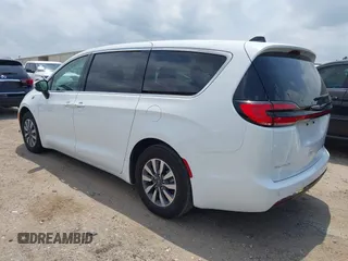 2023 Chrysler Pacifica Hybrid Touring L z VIN 2C4RC1L76PR618422, wystawiony jako IAAI lot #42289283 z przebiegiem 40 744 mil mil oraz . Historia ofert i sprzedaży dostępna na DreamBid. Obrazek 3.