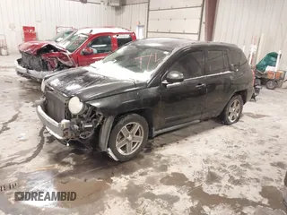 2010 Jeep Compass Sport with VIN 1J4NF4FB0AD501897, listed as a IAAI auction lot 41570009 with 198,376 mi miles. Bid and sale history available at carsss.com. Image 2.