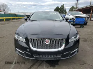 2014 Jaguar XJ Portfolio with VIN SAJWJ2GD4E8V69651, listed as a Copart auction lot 52426195 with 56,413 mi miles and Salvage title. Bid and sale history available at DreamBid. Image 5.