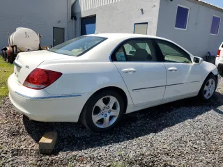 2006 Acura RL z VIN JH4KB16576C012132, wystawiony jako Copart lot #61897805 z przebiegiem 143 101 mil mil oraz Szkoda całkowita • Salvage title. Historia ofert i sprzedaży dostępna na DreamBid. Obrazek 3.