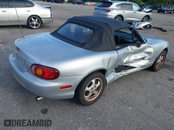 1999 Mazda MX-5 Miata with VIN JM1NB3534X0124237, listed as a IAAI auction lot 42536654 with 92,696 mi miles and . Bid and sale history available at DreamBid. Image 4.